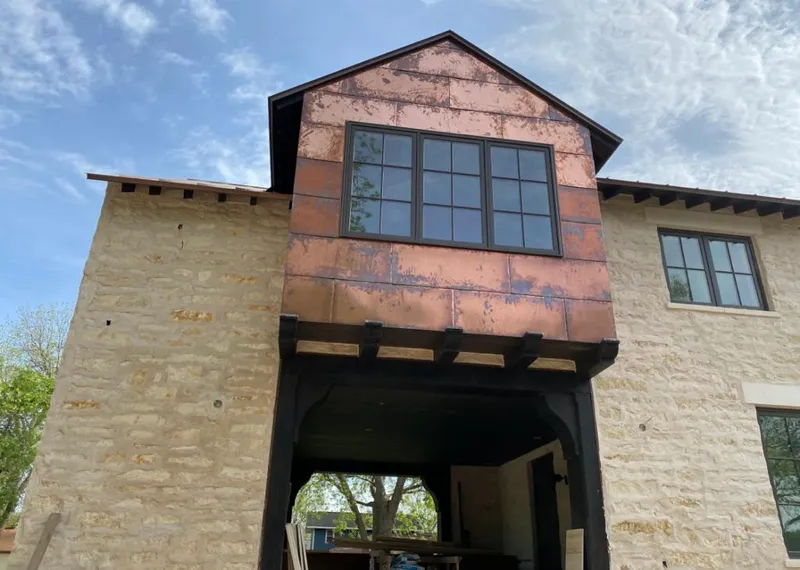 Copper metal panel facade on a stone building for Skylight Installation in Dayton